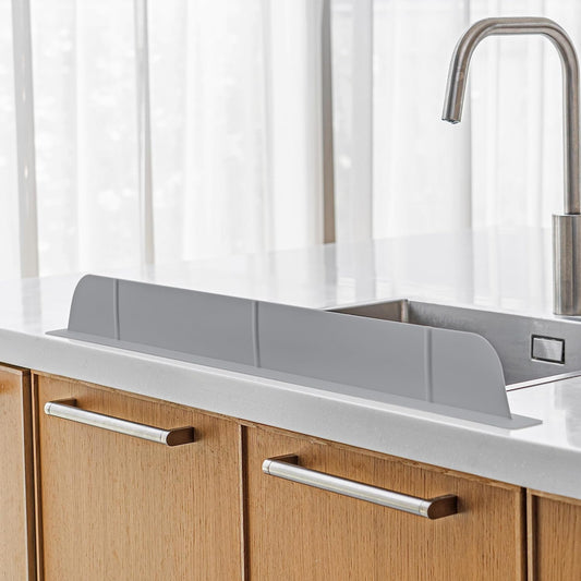 30-inch silicone kitchen sink splash guard installed on countertop